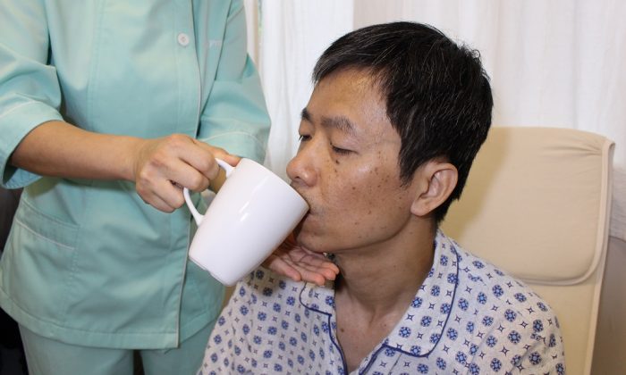 adult health worker feeding